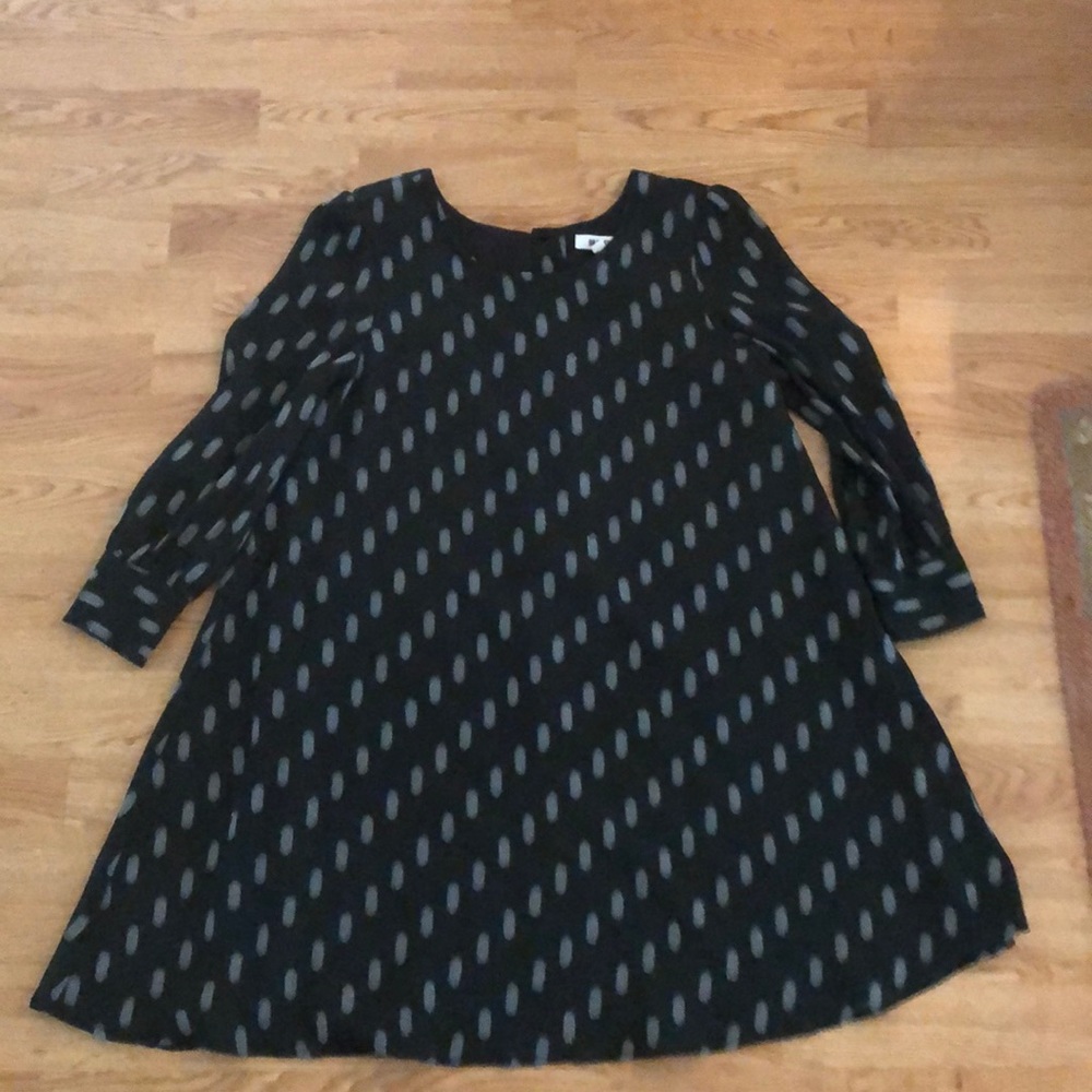 a black dress with metallic/silver dot print